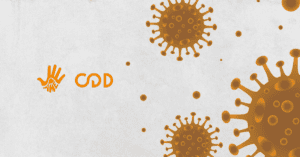 Fundo cinza, mais centralizado à direita, ilustrações em tom de amarelo escuro de moléculas que representam o coronavírus.